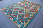 Handmade Afghan Kilim Rug – 128x183 cm | Turquoise & Multicolor Tribal Wool Carpet