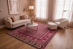 Handwoven Afghan flatweave rug featuring traditional diamond motifs in soft pink and ivory tones