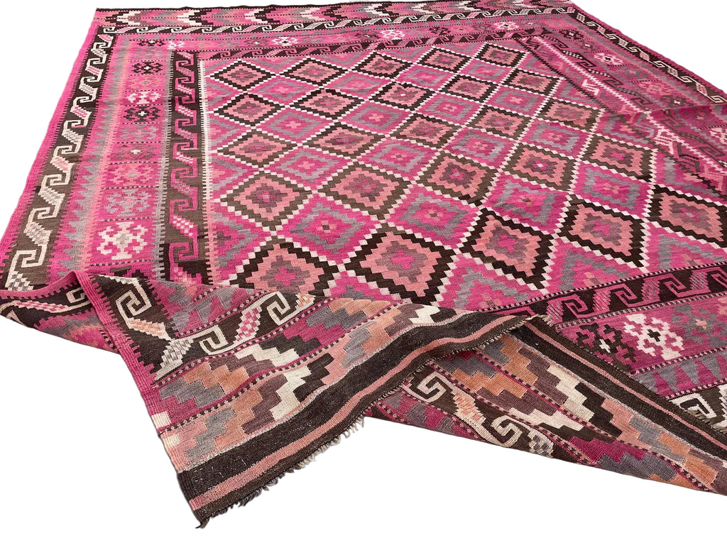 Handwoven Afghan Kilim rug styled as a statement piece for living rooms and contemporary interiors