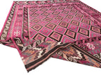 Handwoven Afghan Kilim rug styled as a statement piece for living rooms and contemporary interiors