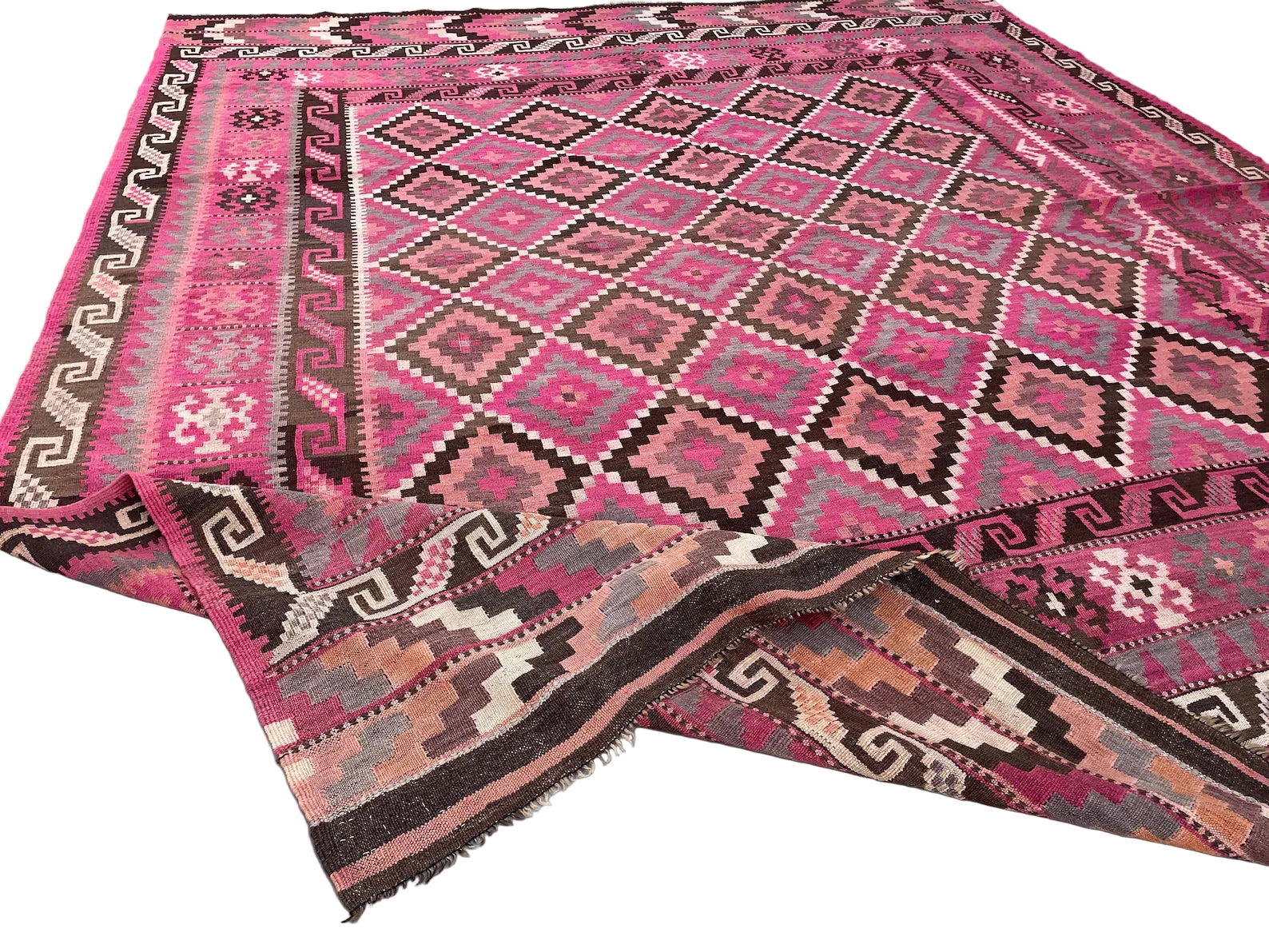 Handwoven Afghan Kilim rug styled as a statement piece for living rooms and contemporary interiors