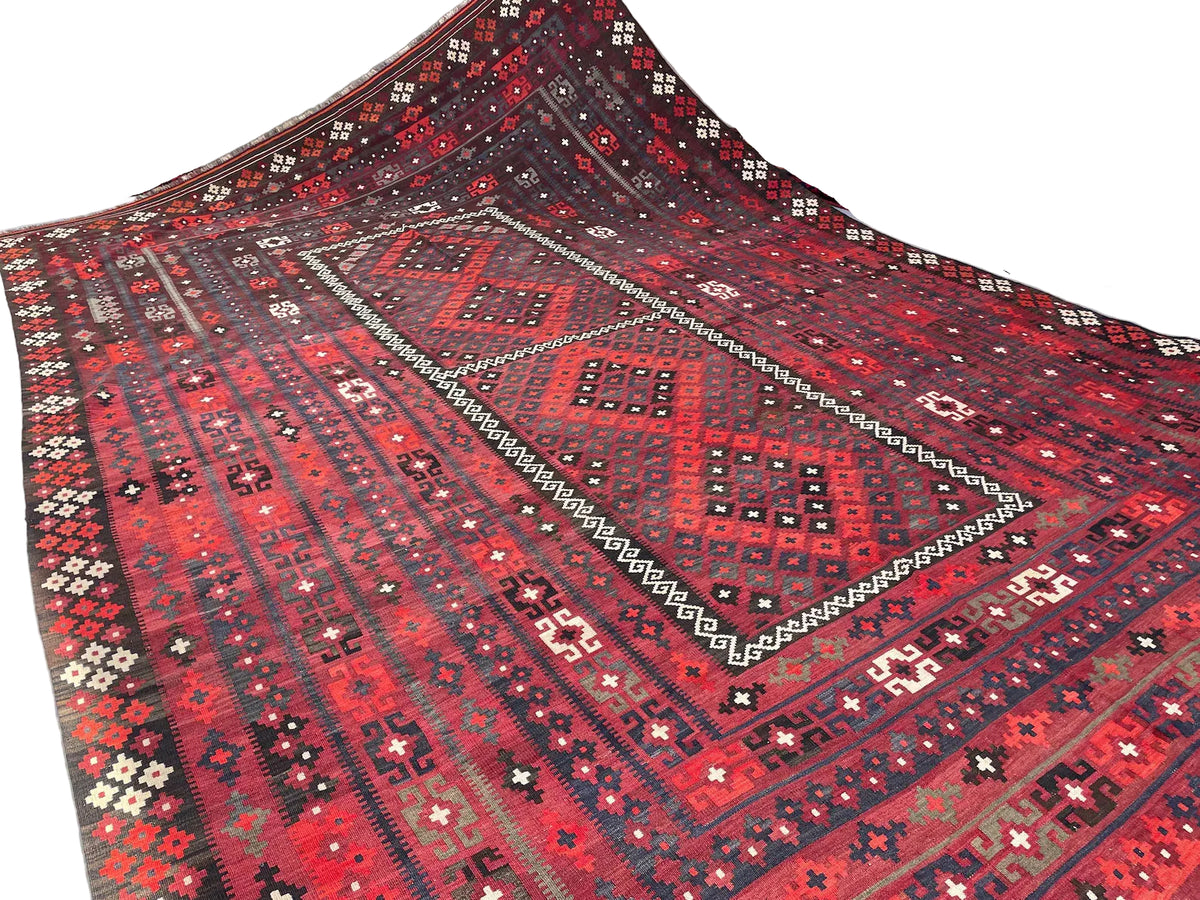 Extra-large Afghan Kilim rug measuring 290 x 472 cm, featuring crimson red and black geometric diamond patterns with intricate traditional tribal borders.