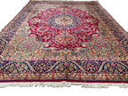 Large ruby-red Persian-style Oriental rug measuring 267 x 345 cm, featuring an intricate floral medallion, ivory botanical patterns and navy decorative borders.